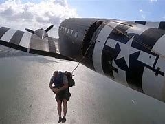 Man exiting plane door